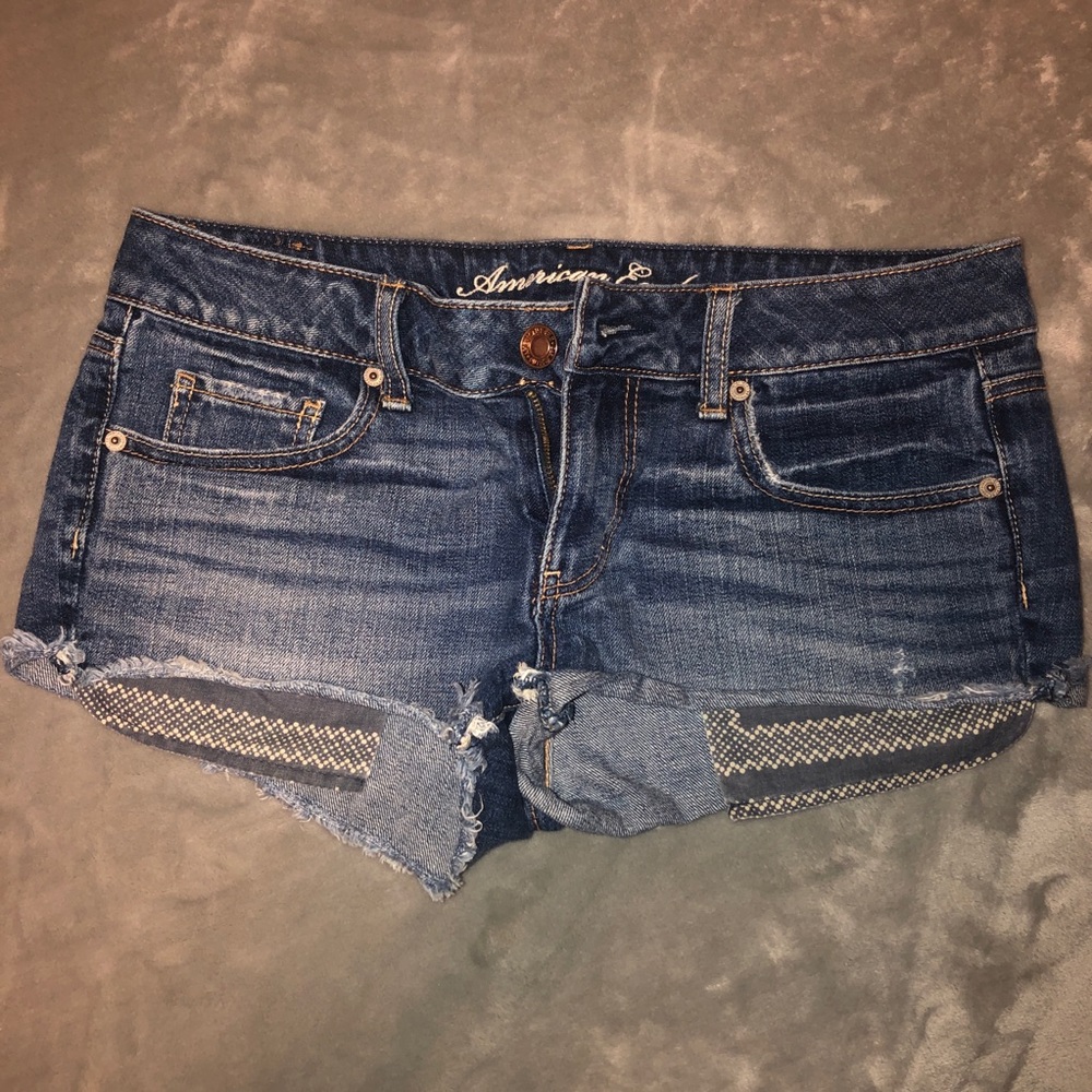 American Eagle classic distressed cutoff denim shorties with print pockets